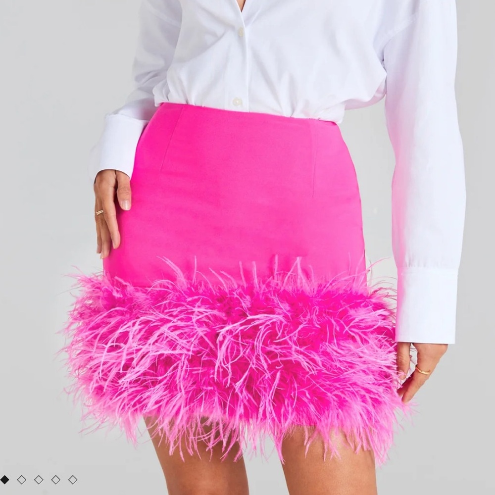 Fun bright pink feathered skirt by Nadine Merabi
